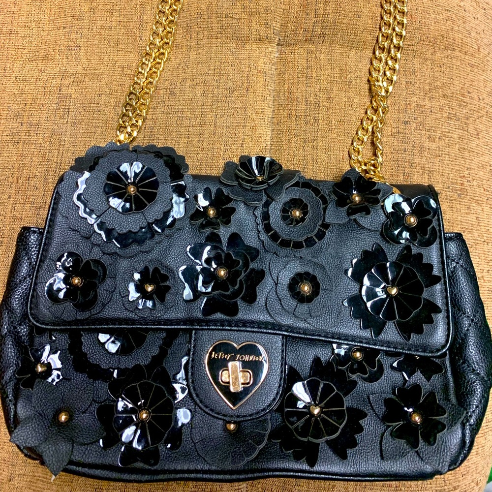 Black floral Betsy Johnson purse with gold chain straps